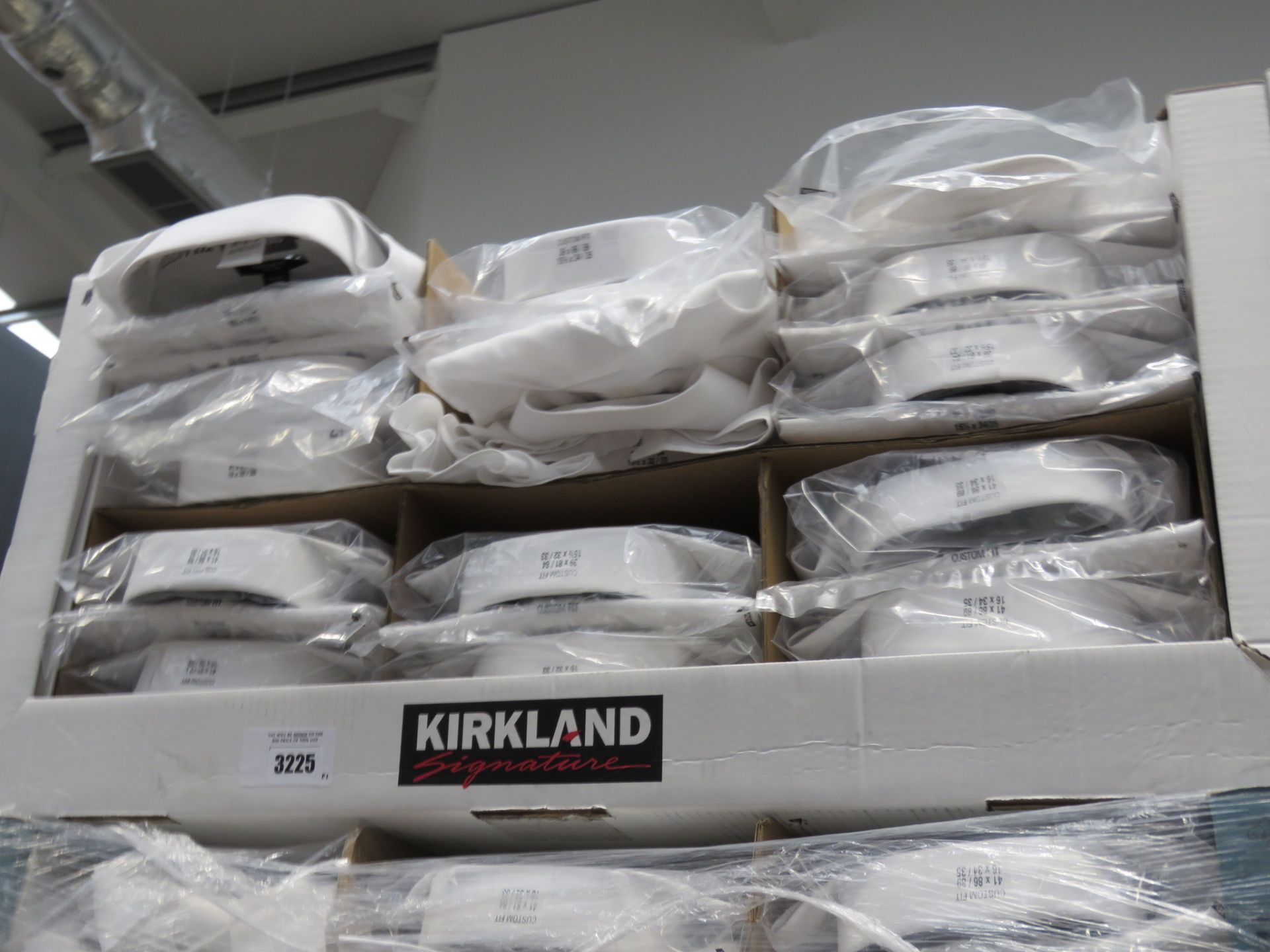 Tray containing gents Kirkland shirts