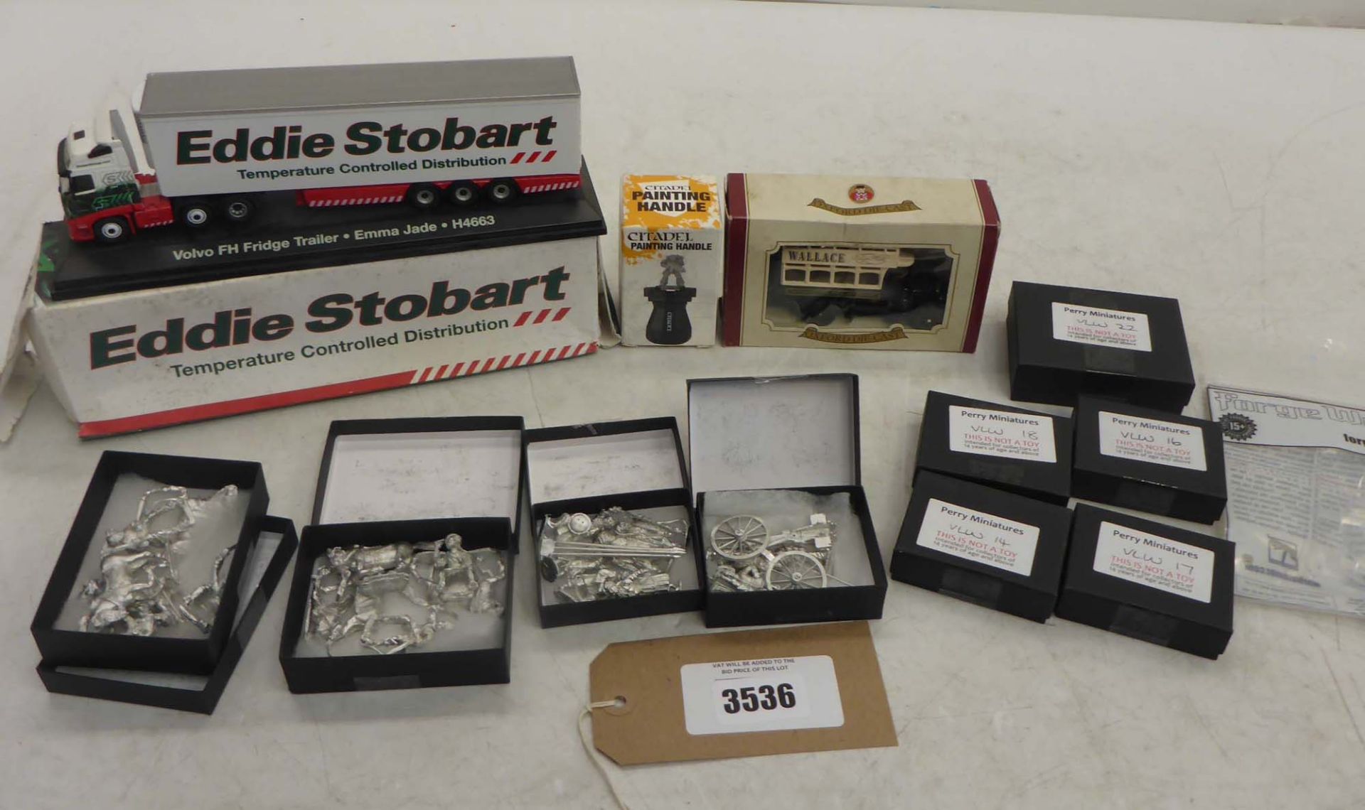 9 packs of Perry Miniature models, Eddie Stobard Volvo Fridge trailer model, Citadel painting handle