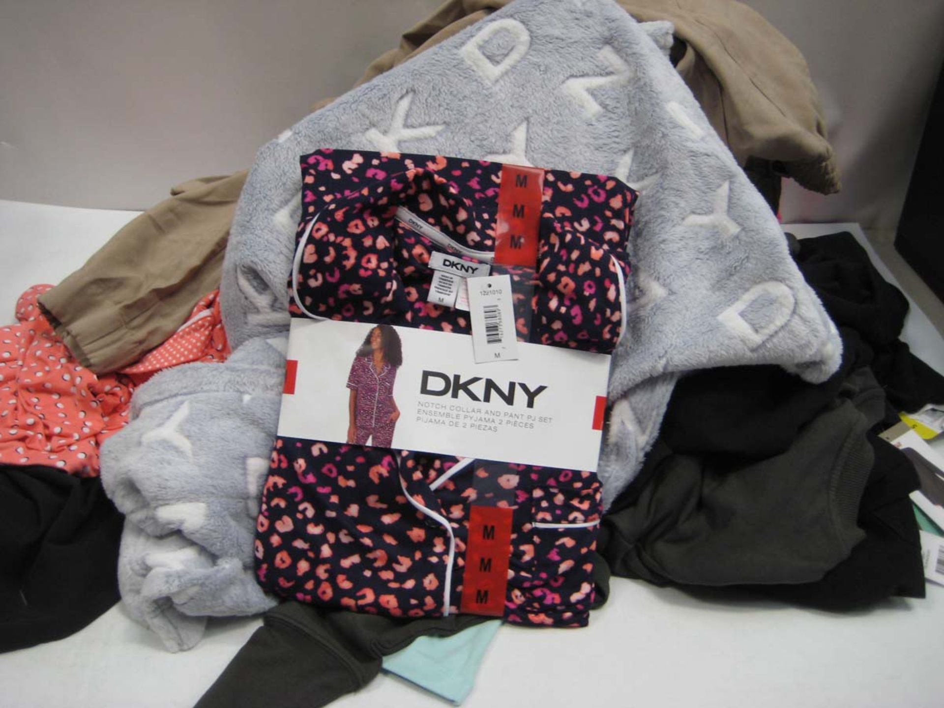 Bag of ladies clothes to include, Superdry t-shirt, Fila t-shirt, DKNY lounge wear, trousers etc.