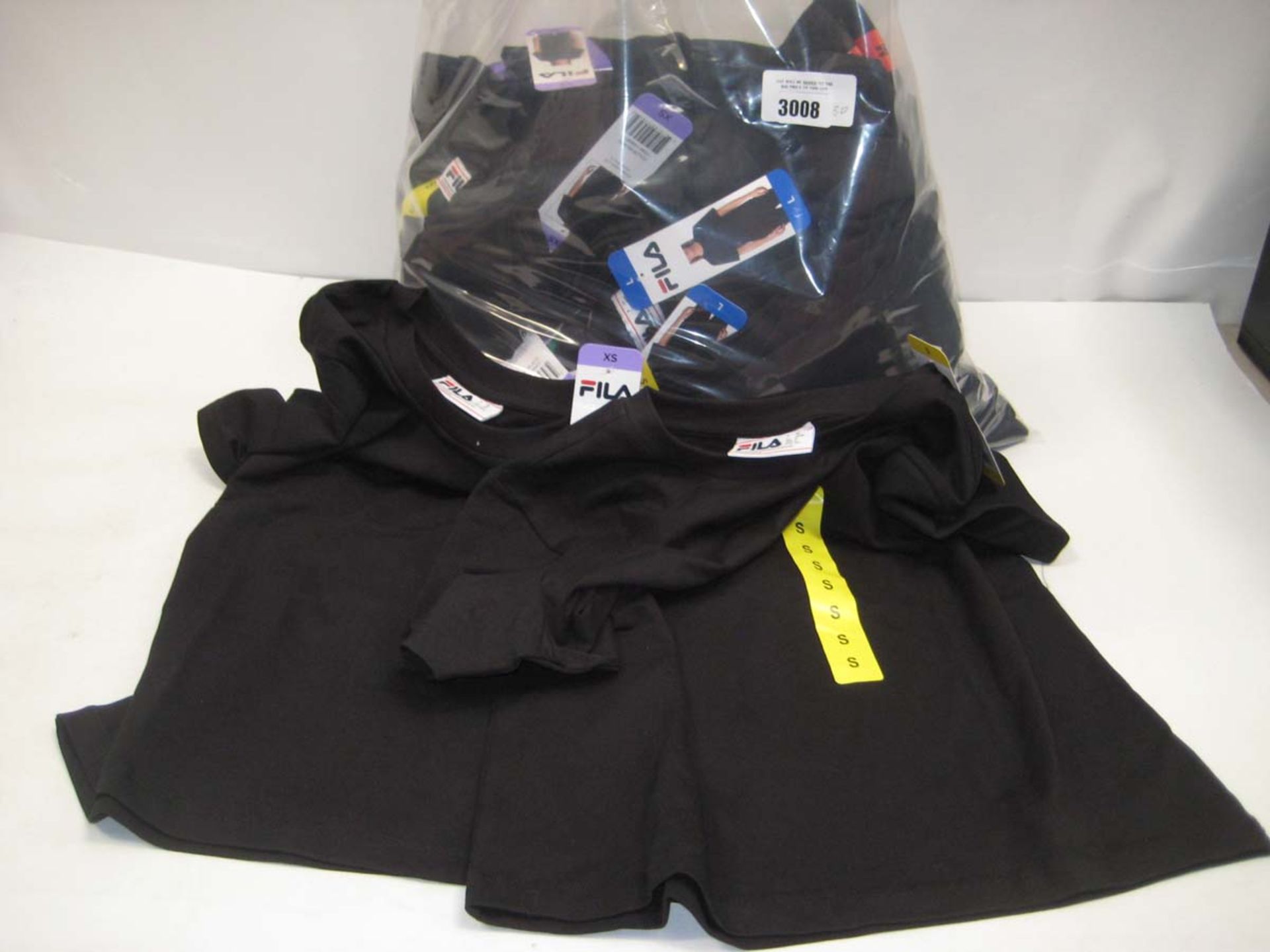 Bag containing ladies Fila t shirts in black, sizing x small to x large.