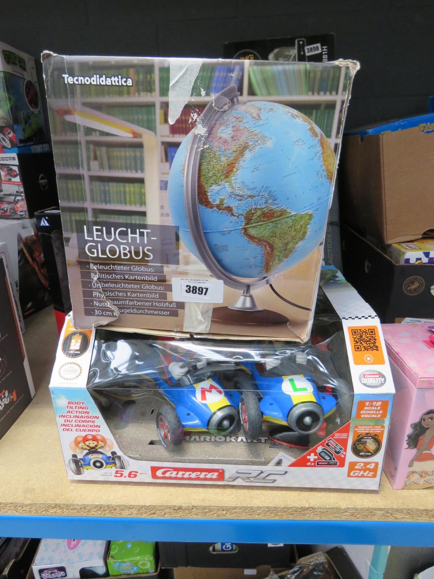 Collection of kids toys incl. illuminated globe, mario kart race game, and Disney princess makeup