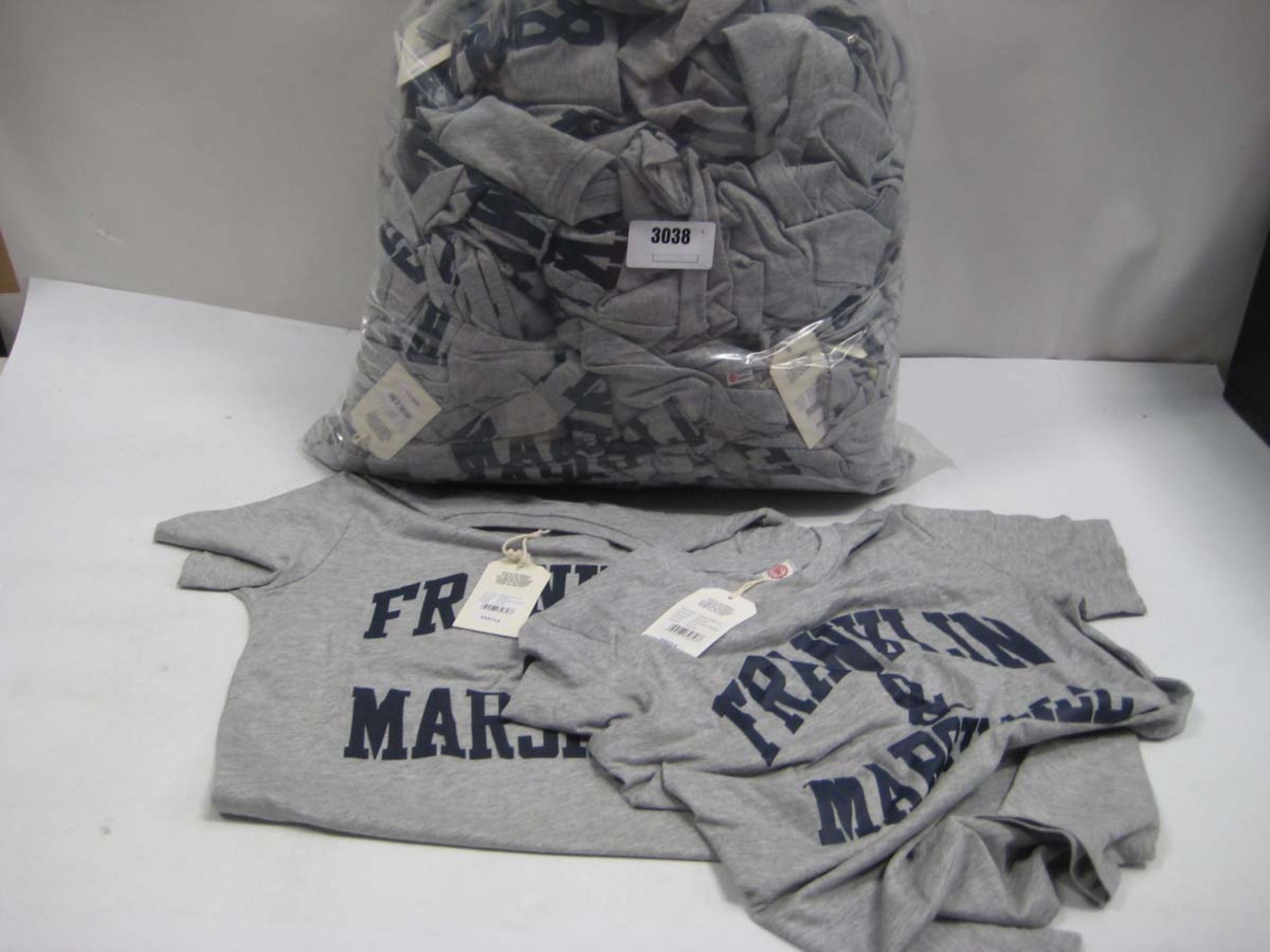 Bag containing Childrens Franklin & Marshall t shirts in grey, various sizes.