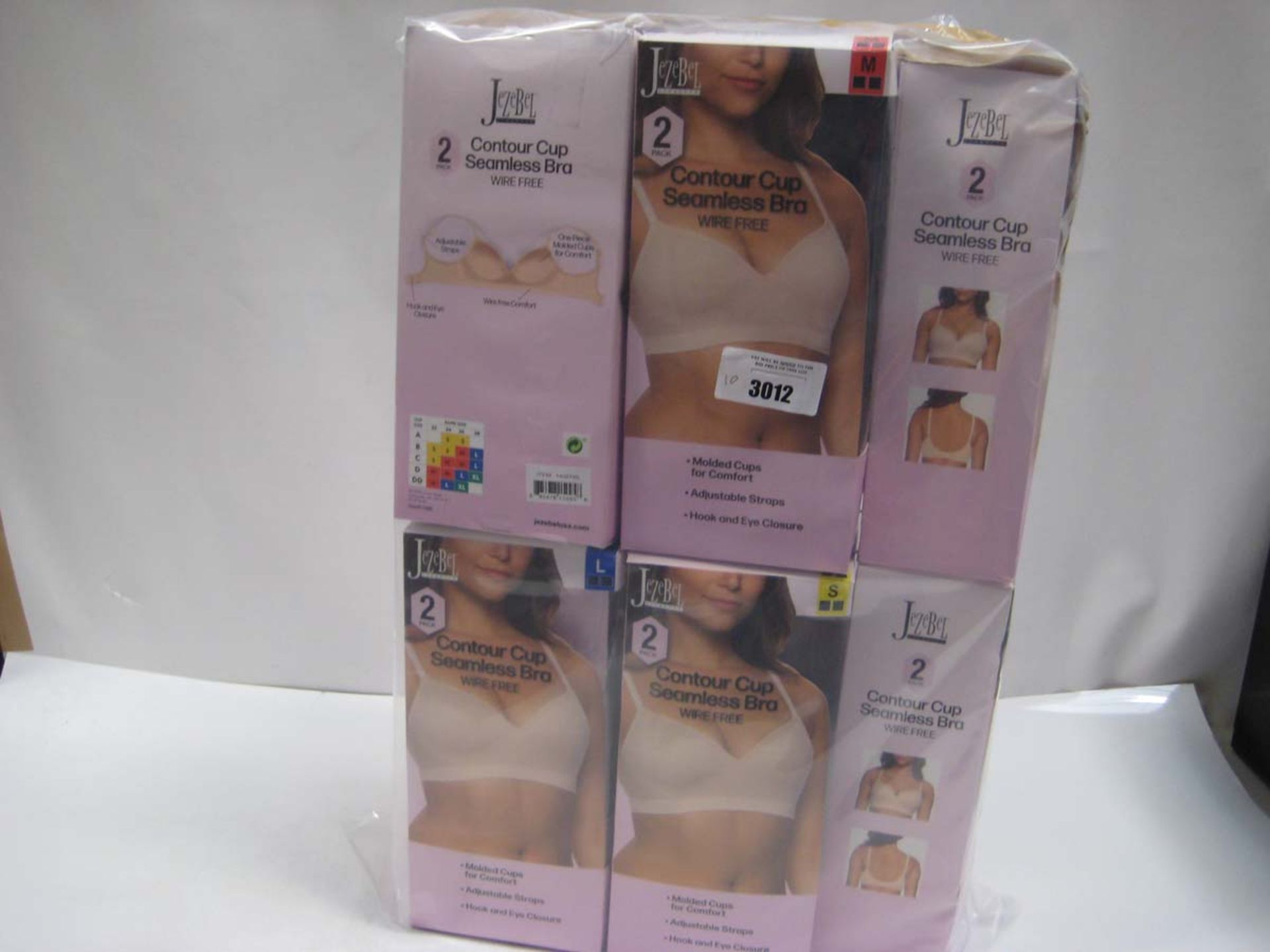 Bag containing 10 boxes of Jezebel Contour Cup Seamless Bras. Sizing small to large.