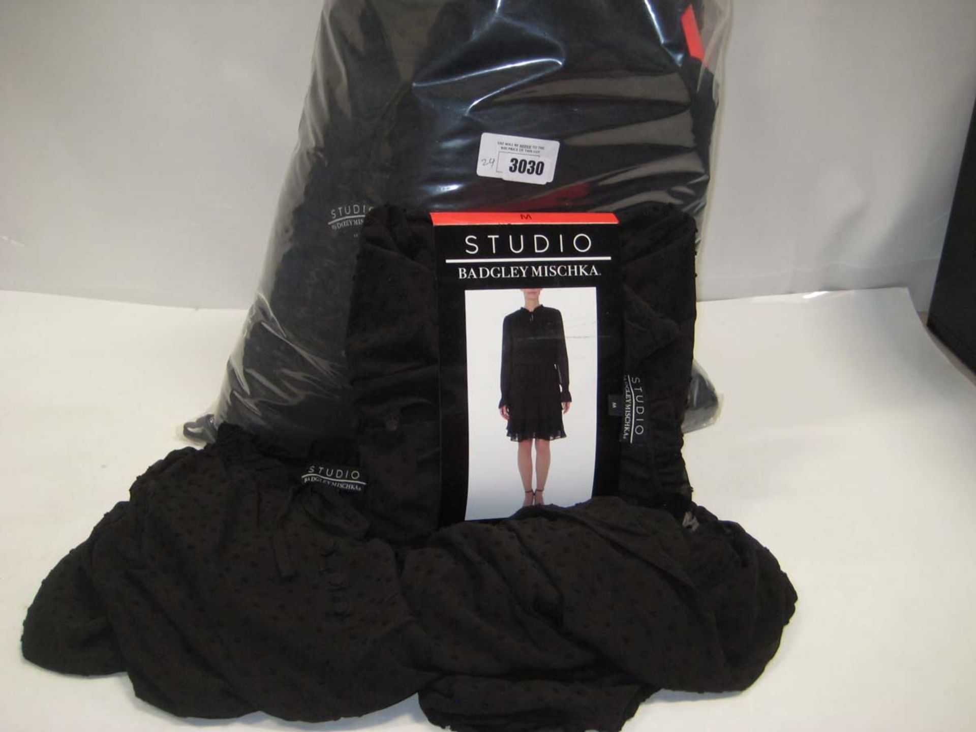 Bag containing 24 Studio Badgley Mischka ladies dresses in black, various sizes.