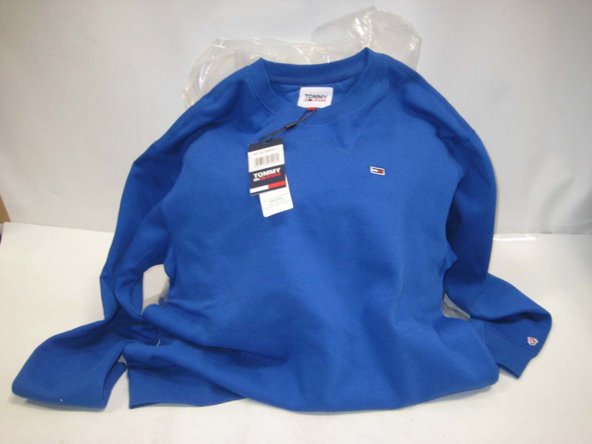 Bag containing 9 Tommy Jeans Sweatshirts in blue, various sizes.