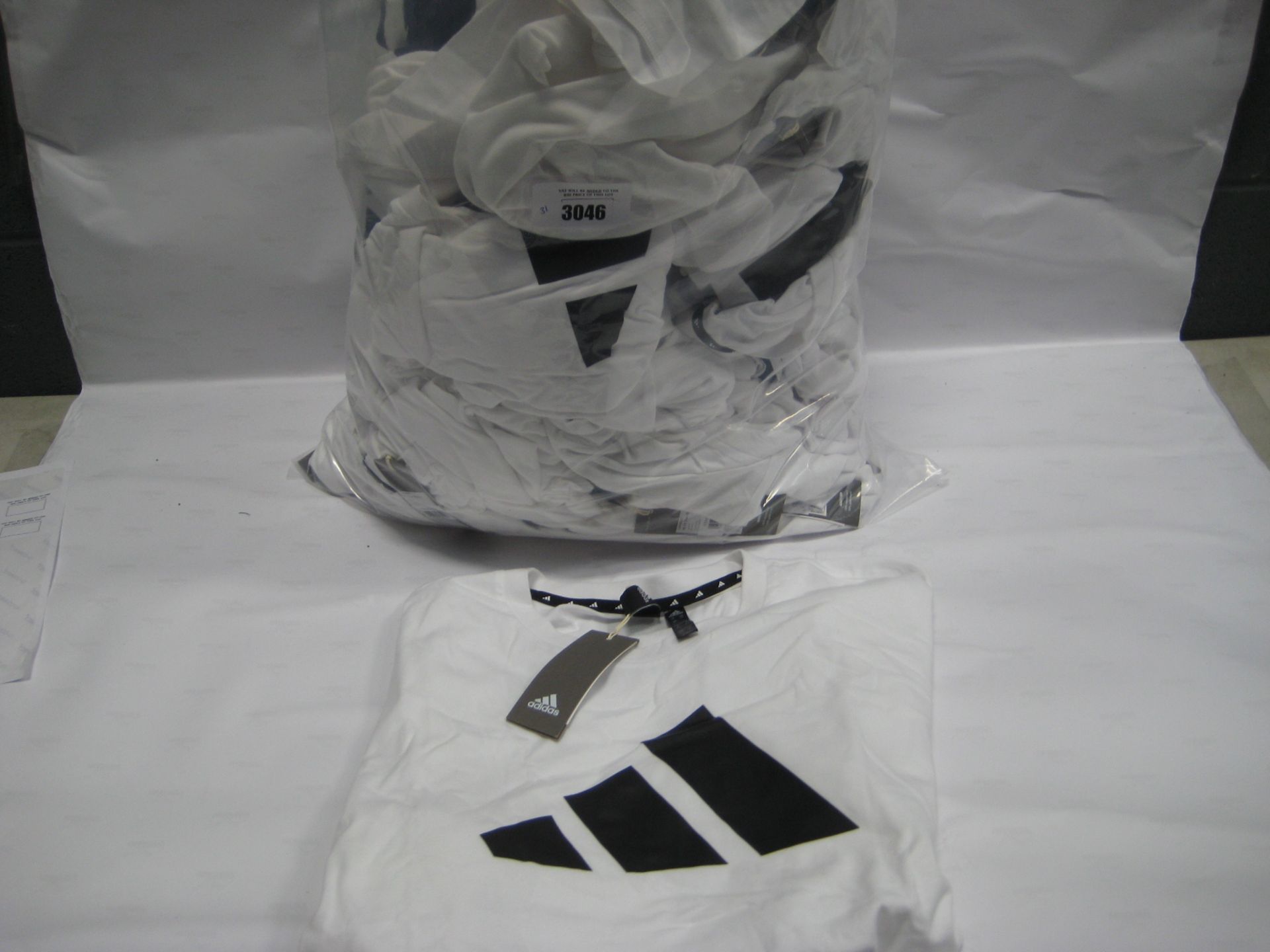 Bag containing 31 mens Adidas t-shirts in white, sizes L and up