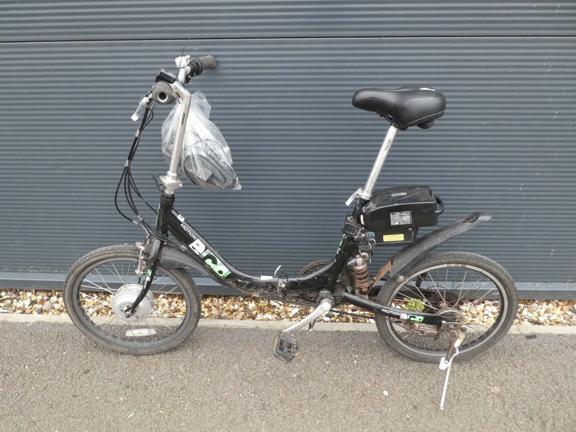 Folding Motion electric bike in black with charger