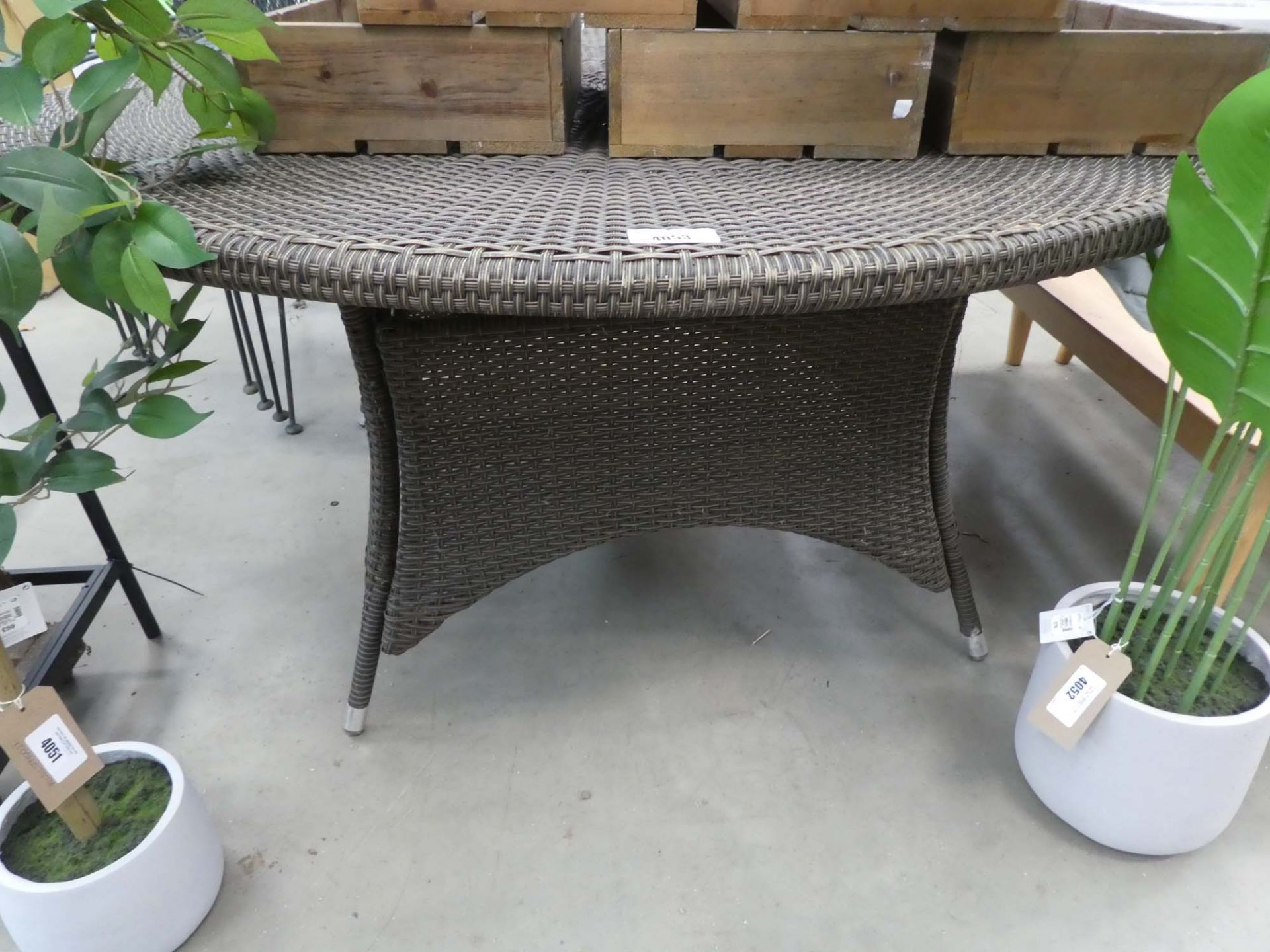 Circular rattan garden table in brown on matching base