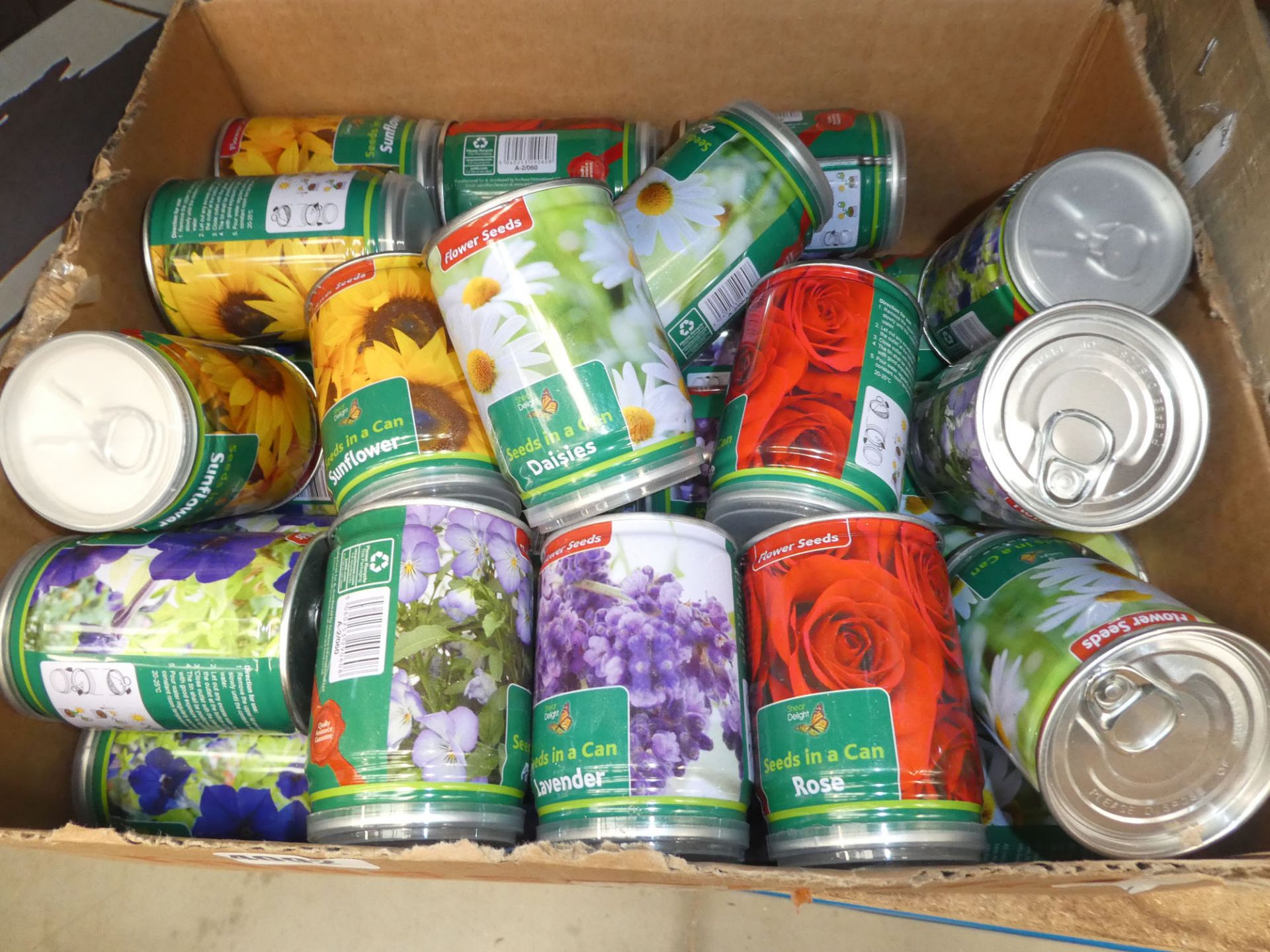 Box of tinned seeds in cans