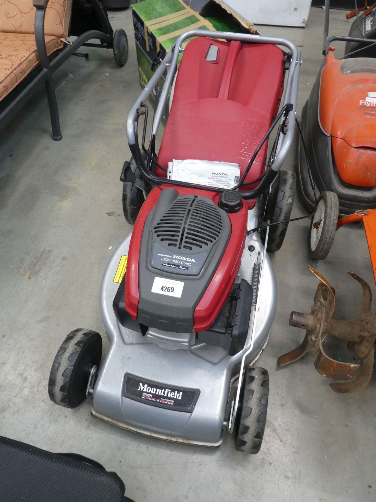 Mountfield silver and red rotary mower with grass box
