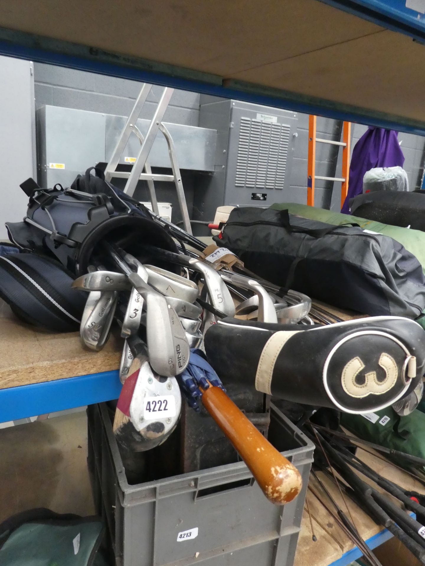 Golf bag containing Ping and other clubs