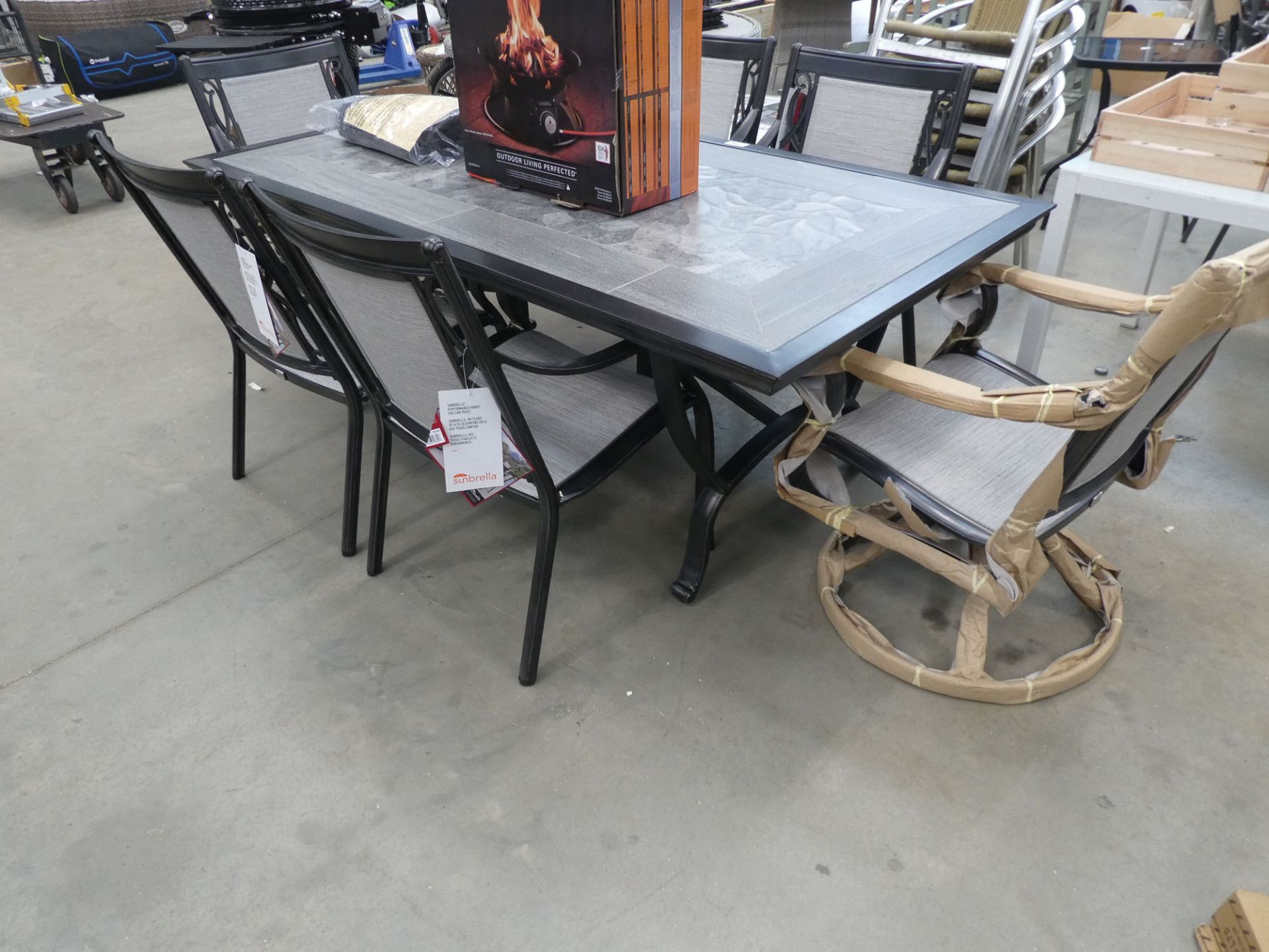 Large tile topped rectangular garden table with 4 stationery chairs and 2 swivel chairs plus cover