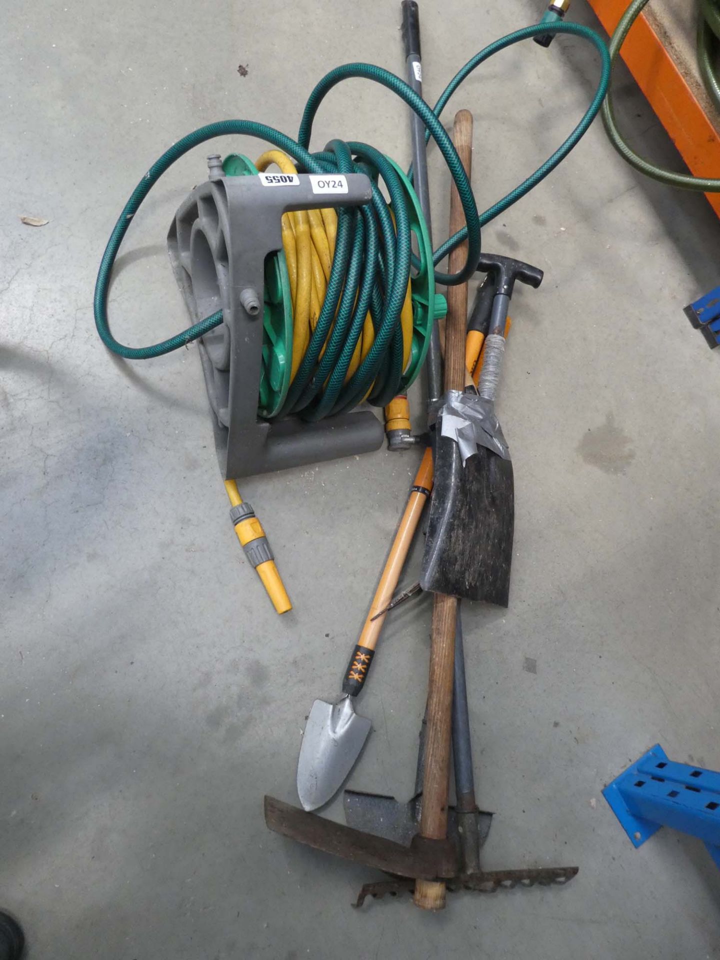 Small quantity of tools and a hose pipe
