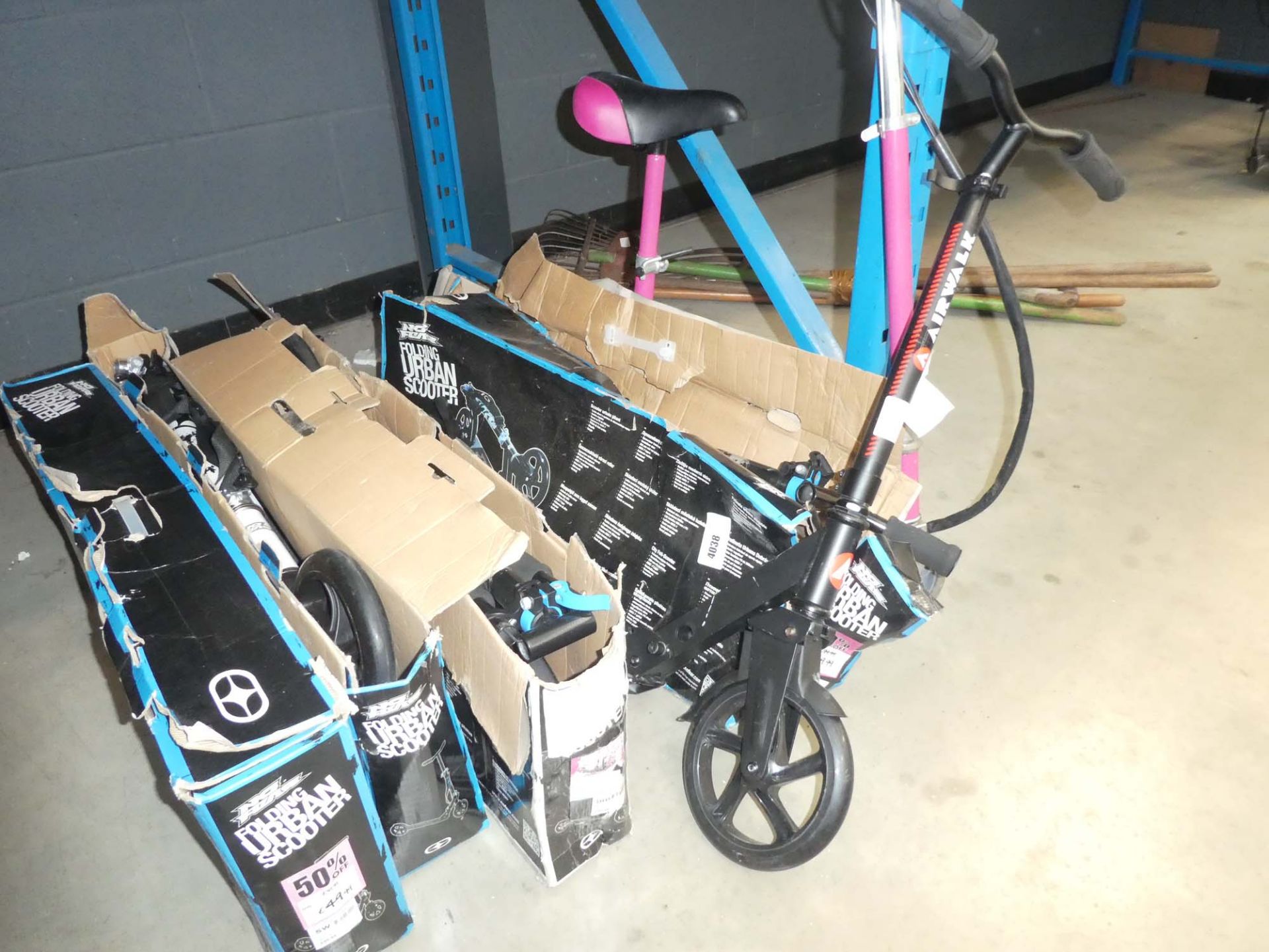 Four boxed and two unboxed scooters