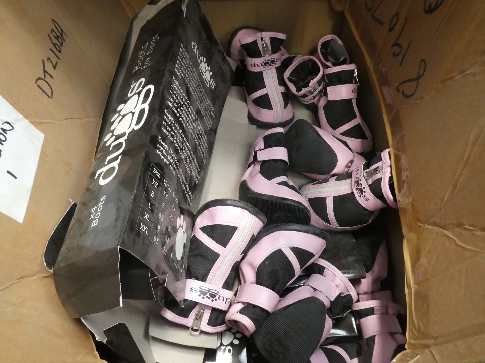 Large box of dog boots and shoes