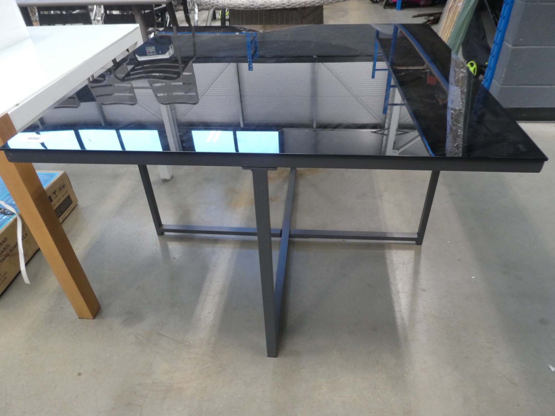Square glass topped black garden table