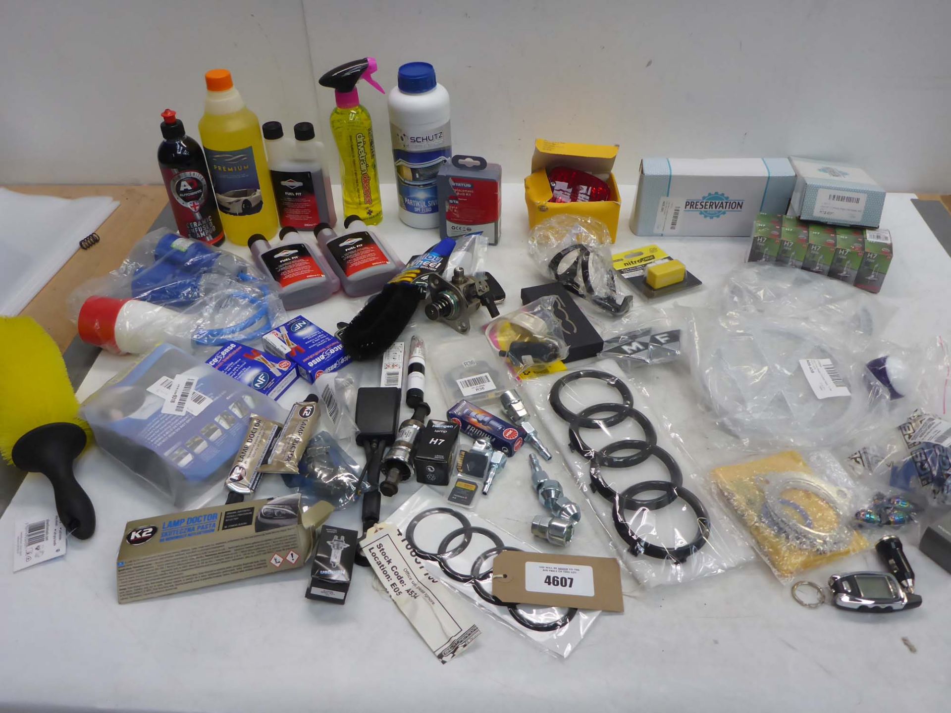 Car parts including Beetle door mirrors, Hella brake light, badges, key rings, headlight bulbs,