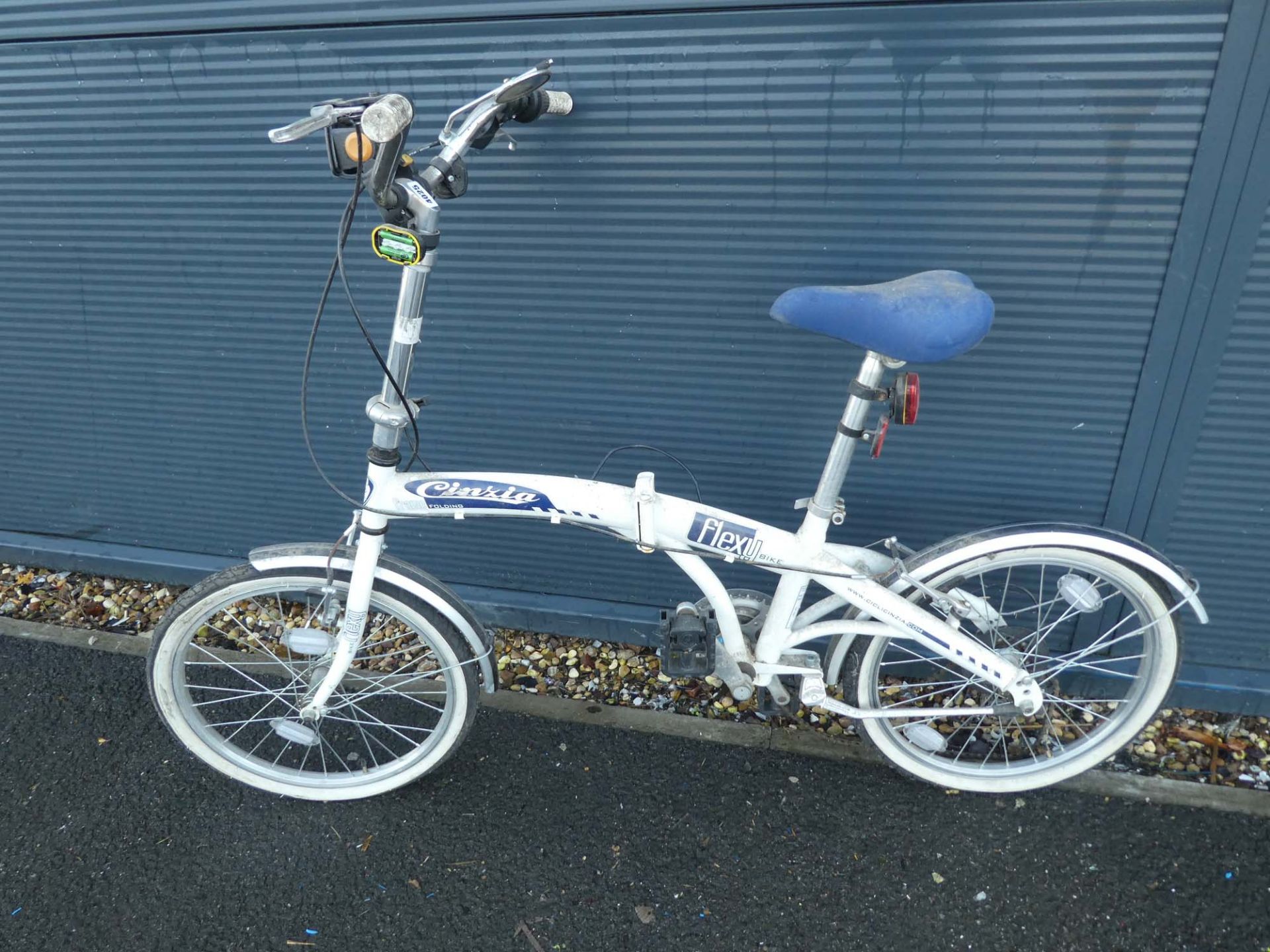 White fold up bike