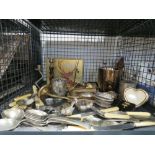 Cage containing loose cutlery, candle sticks and other silver plate