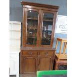 Glazed oak bookcase with cupboard base under