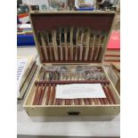 Box containing gloss wood cutlery