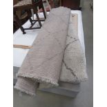 Grey rug measuring 1.6 x 2.3m