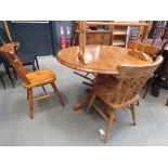 Circular pine pine table plus three matching stickback chairs and one other