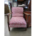 Oak armchair with pink floral cushions