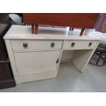 Cream painted dressing chest with two drawers and cupboard to the side