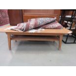 Bent teak coffee table with second tier