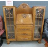 Oak bureau with drawers and glassed cupboards to the side