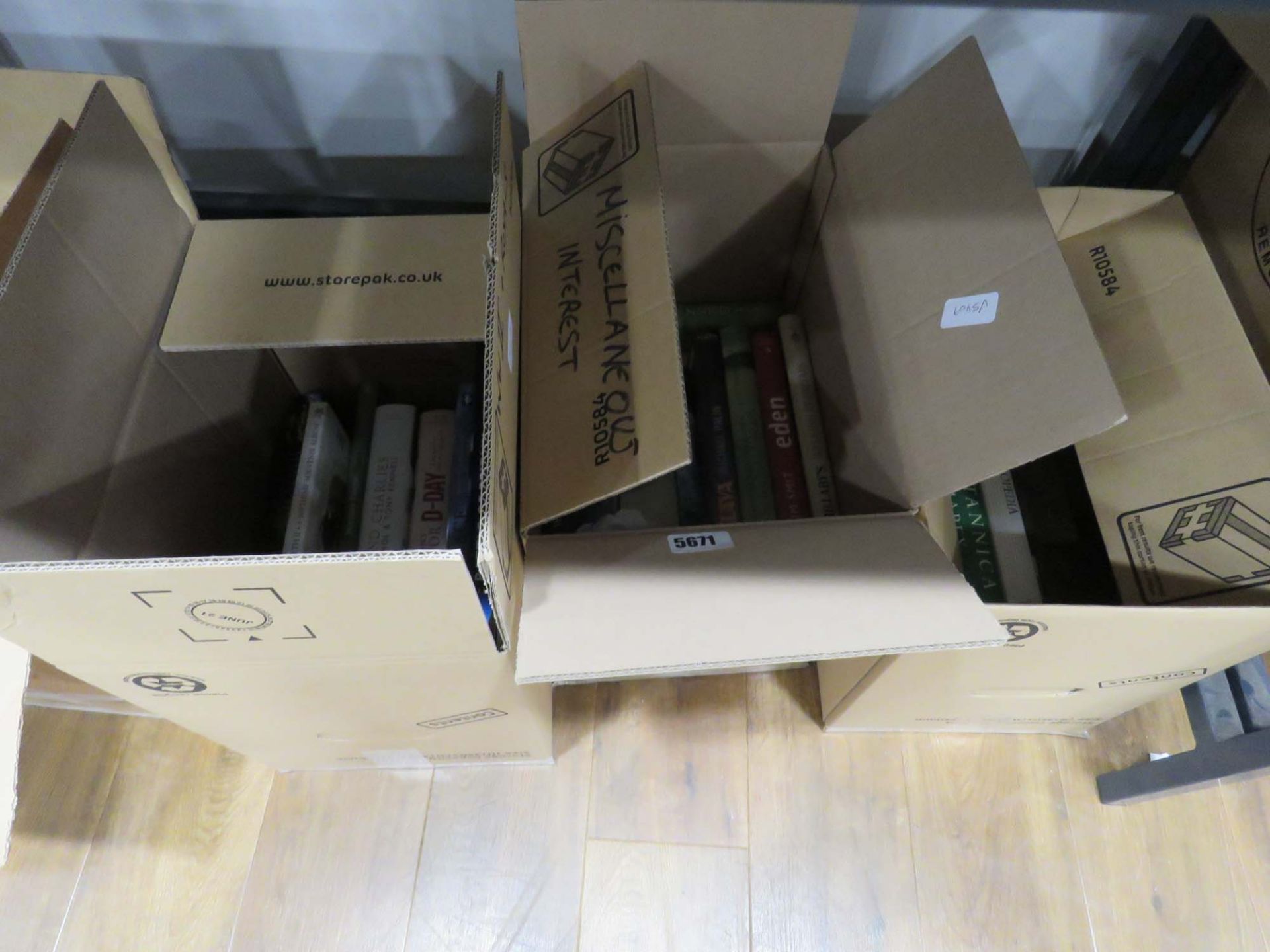 3 boxes containing botanical military and travel reference books