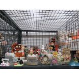 Cage containing ornamental animal figures and ornamental furniture items