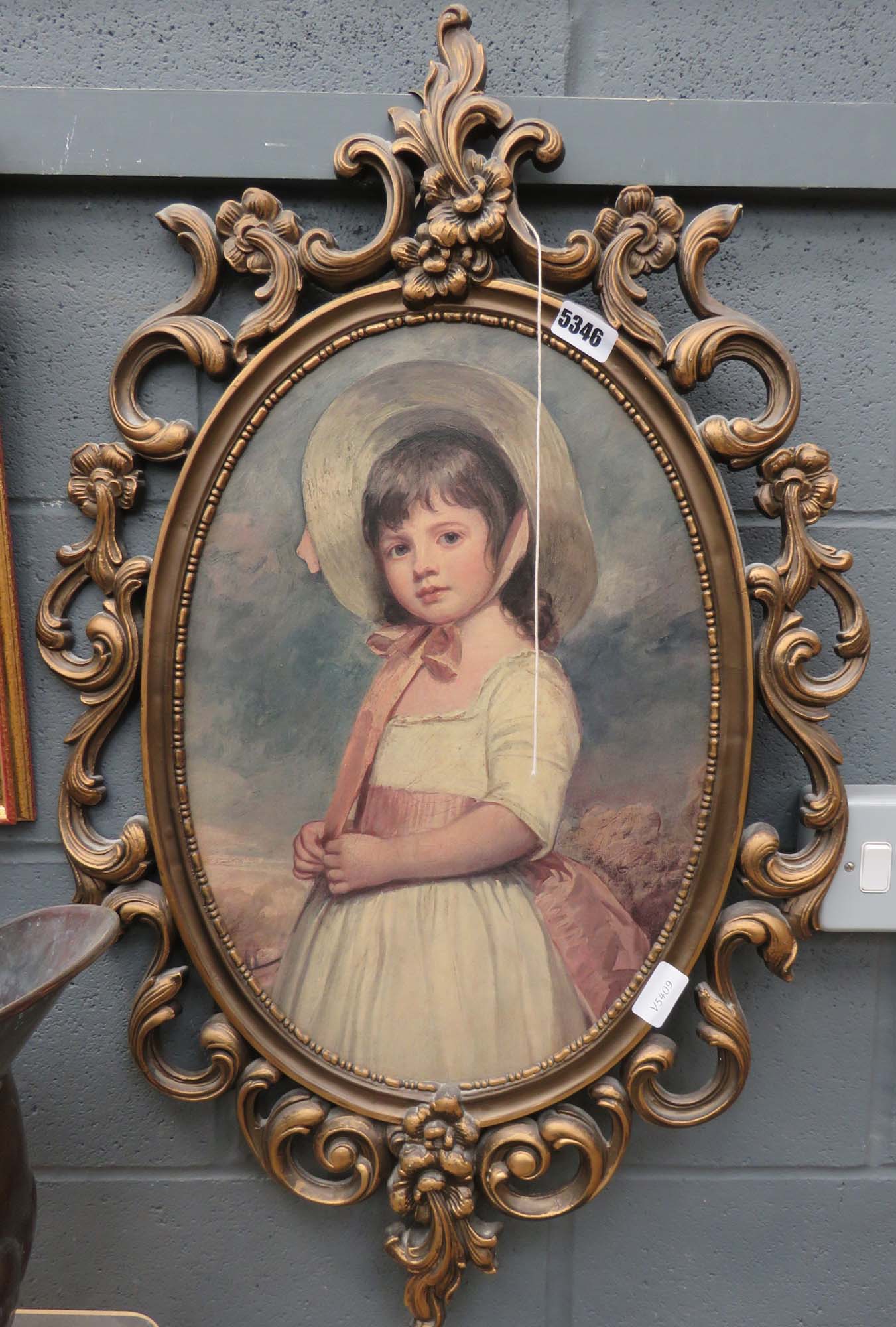 Oval print of a young girl in decorative frame