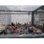 Cage containing resin animal figures