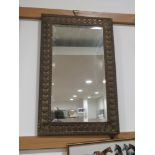 Small rectangular bevelled mirror in brass frame