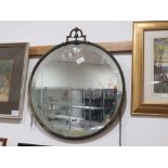 Circular bevelled mirror in metal frame