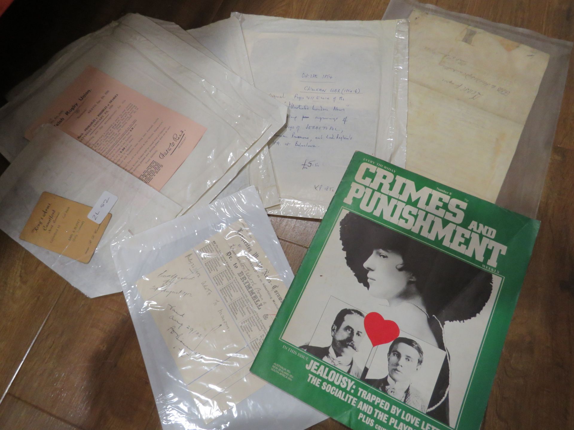 Box containing childrens and adult novels plus ephemera and stamp albums - Image 2 of 2