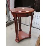 Circular lamp table with second tier and drawer