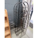 Four dome topped metal wine racks