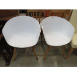 Pair of moulded plastic tub chairs