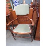 Green upholstered Edwardian armchair