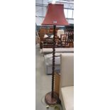 Oak barley twist floor lamp with red fabric shade