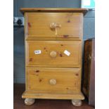 Pine three drawer bedside cabinet