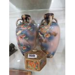 Pair of floral painted vases plus an Oriental lidded pot