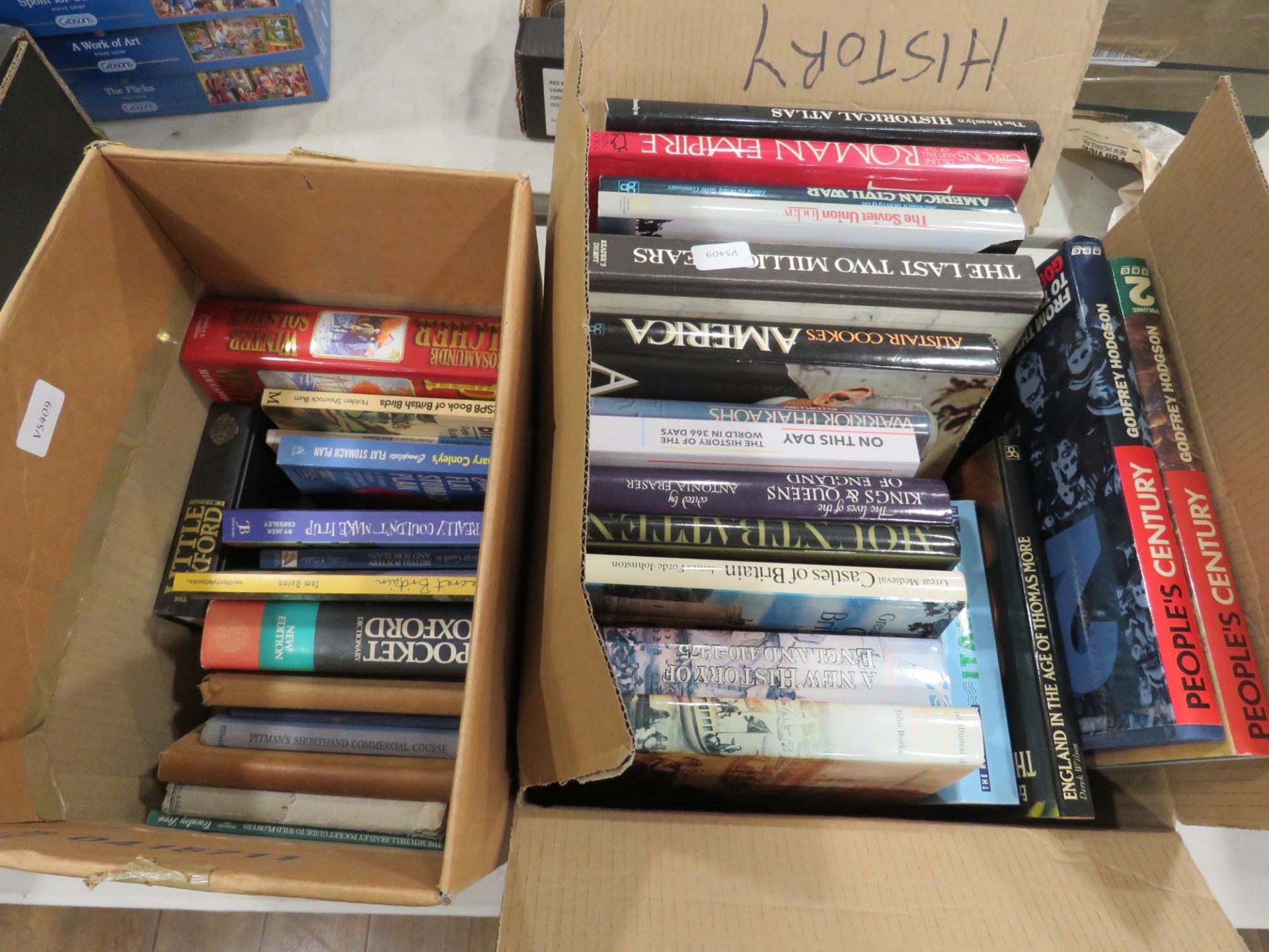 2 boxes containing dictionaries, childrens novels and reference books
