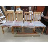 Four beech dining chairs with brown leather effect seats