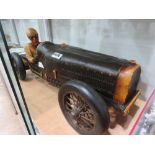 Resin figure of a vintage racing car with driver