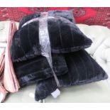 Three black fabric cushions