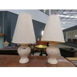 Pair of cream painted pottery table lamps with cream shades